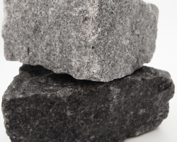 Wet dark grey granite cobbles