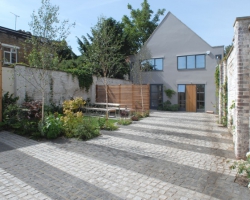 A Hampstead mews development with grey and dark grey demarcations