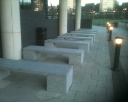 A row of school benches in granite