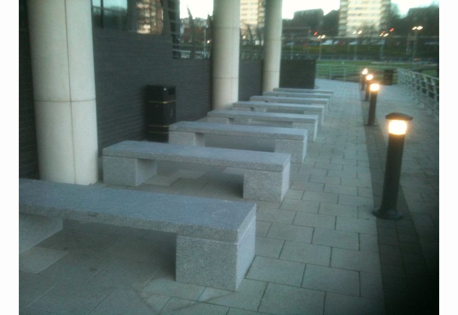 A row of school benches in granite